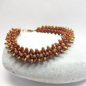 Spiky Copper tone herringbone woven bracelet
